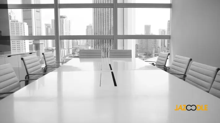 Monochrome picture of business boardroom with Jazoodle logo in the corner